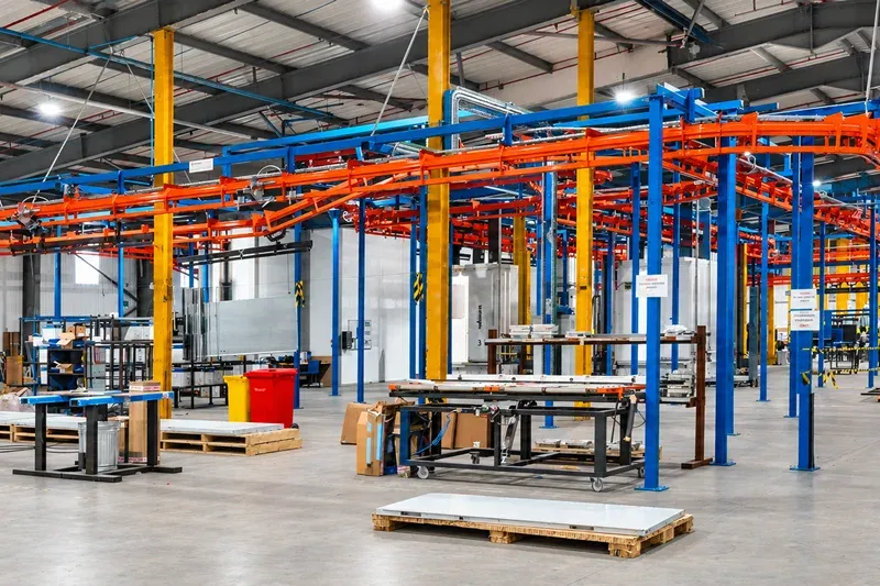 Overhead conveyor system in a specialist door manufacturing facility