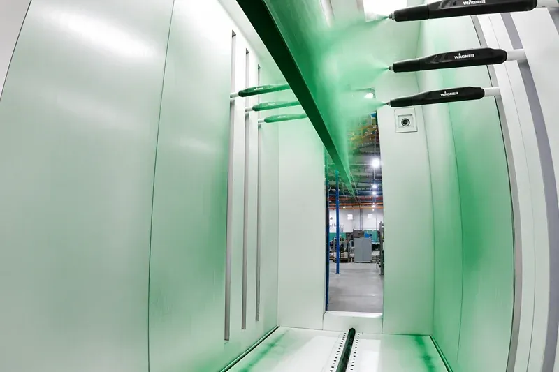Suspended manufactured panels on an overhead conveyor line