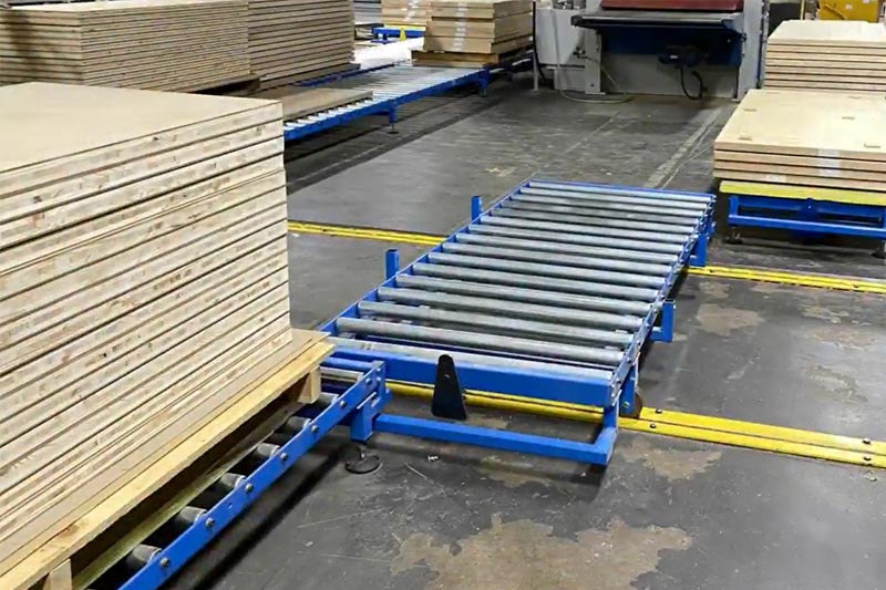 Gravity Roller Conveyor System For Transporting Stacks Of Wooden Sheet